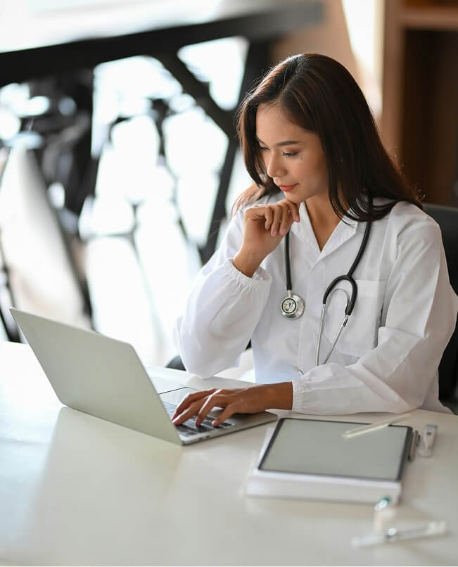 Medical professional on laptop