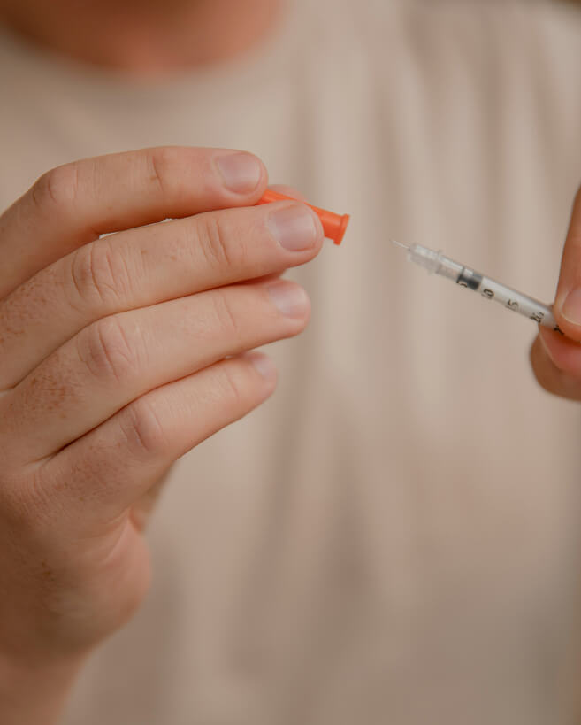 Medical professional with syringe